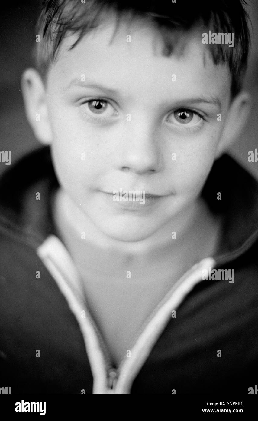 Black and white portrait of a young boy smiling Stock Photo