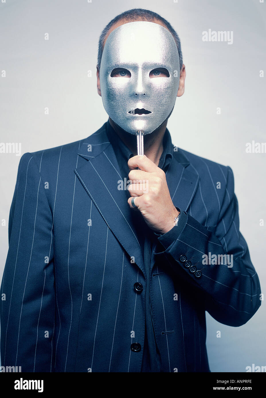 Gangster wearing a mask Stock Photo - Alamy