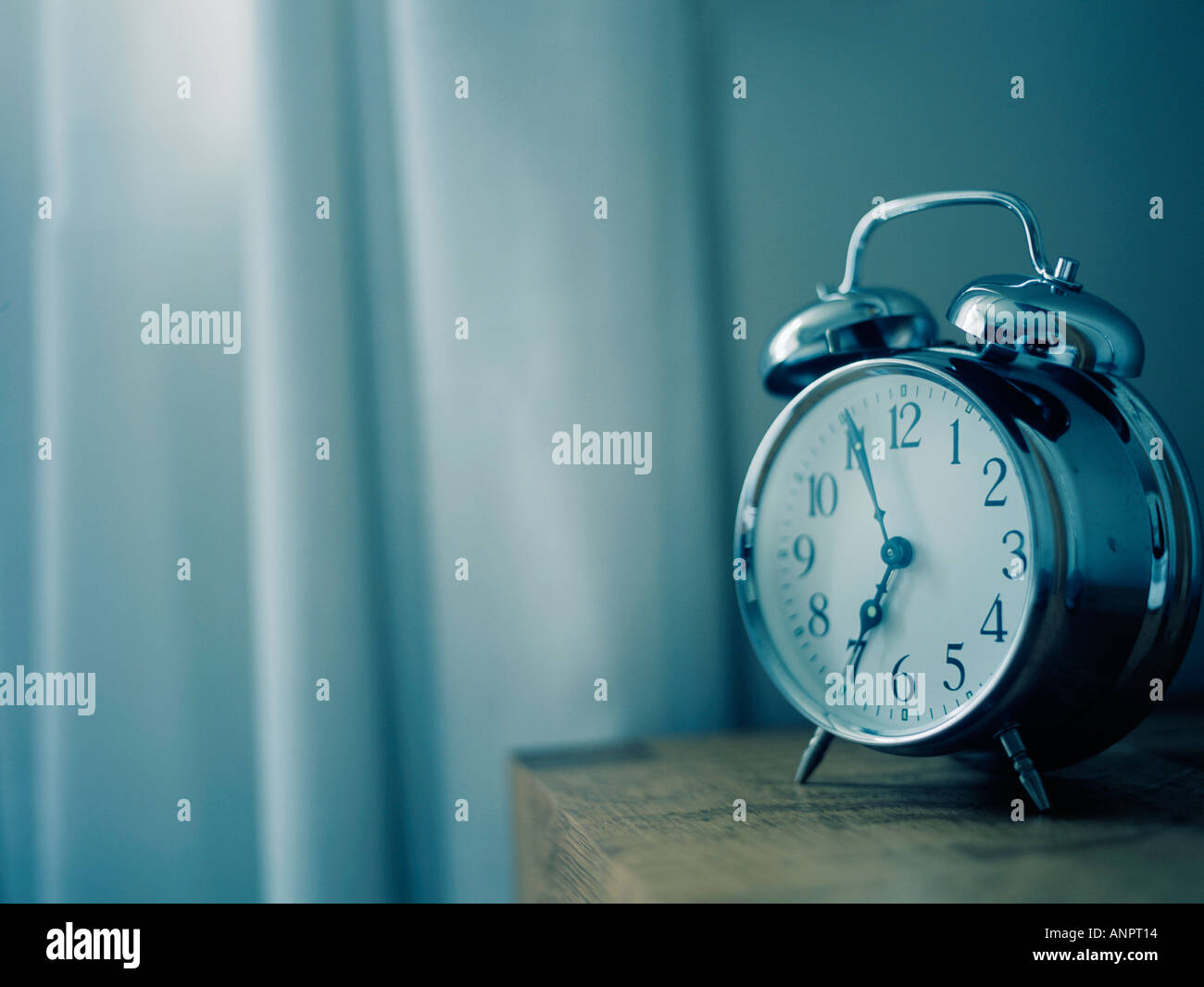 an old fashioned chrome alarm clock Stock Photo Alamy