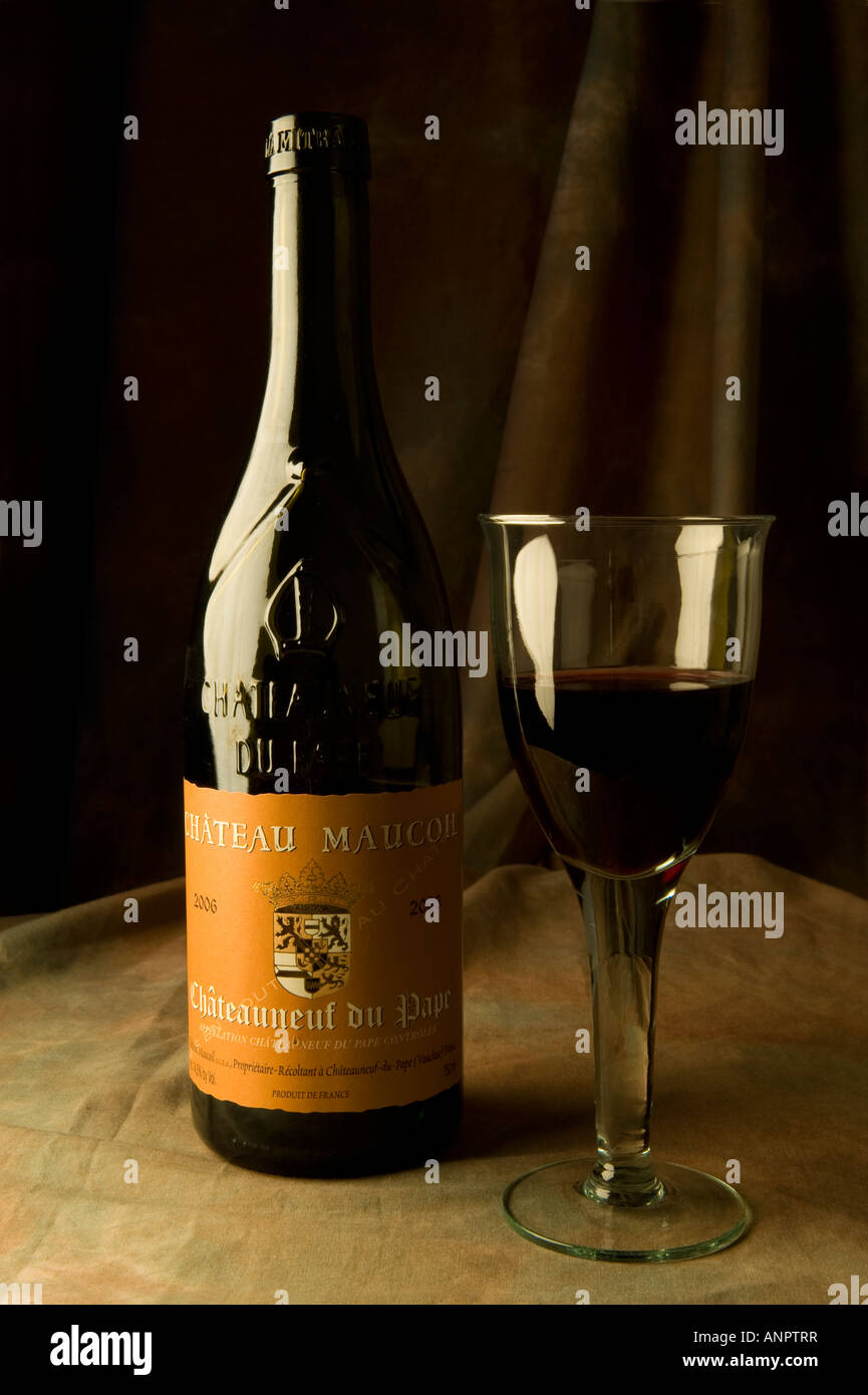 Chateau Maucoil Chateauneuf Du Pape Wine Bottle And Glass Of Wine Stock Photo Alamy