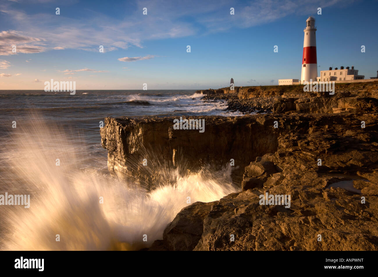 Rough seas crashing into shore at Portland Bill lighthouse Dorset UK Stock Photo