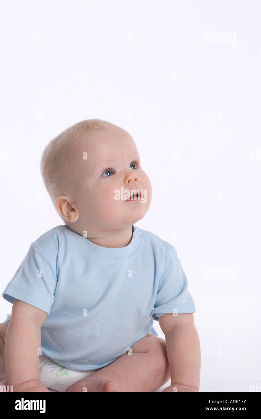 Portrait of a surprised sitting baby Stock Photo - Alamy