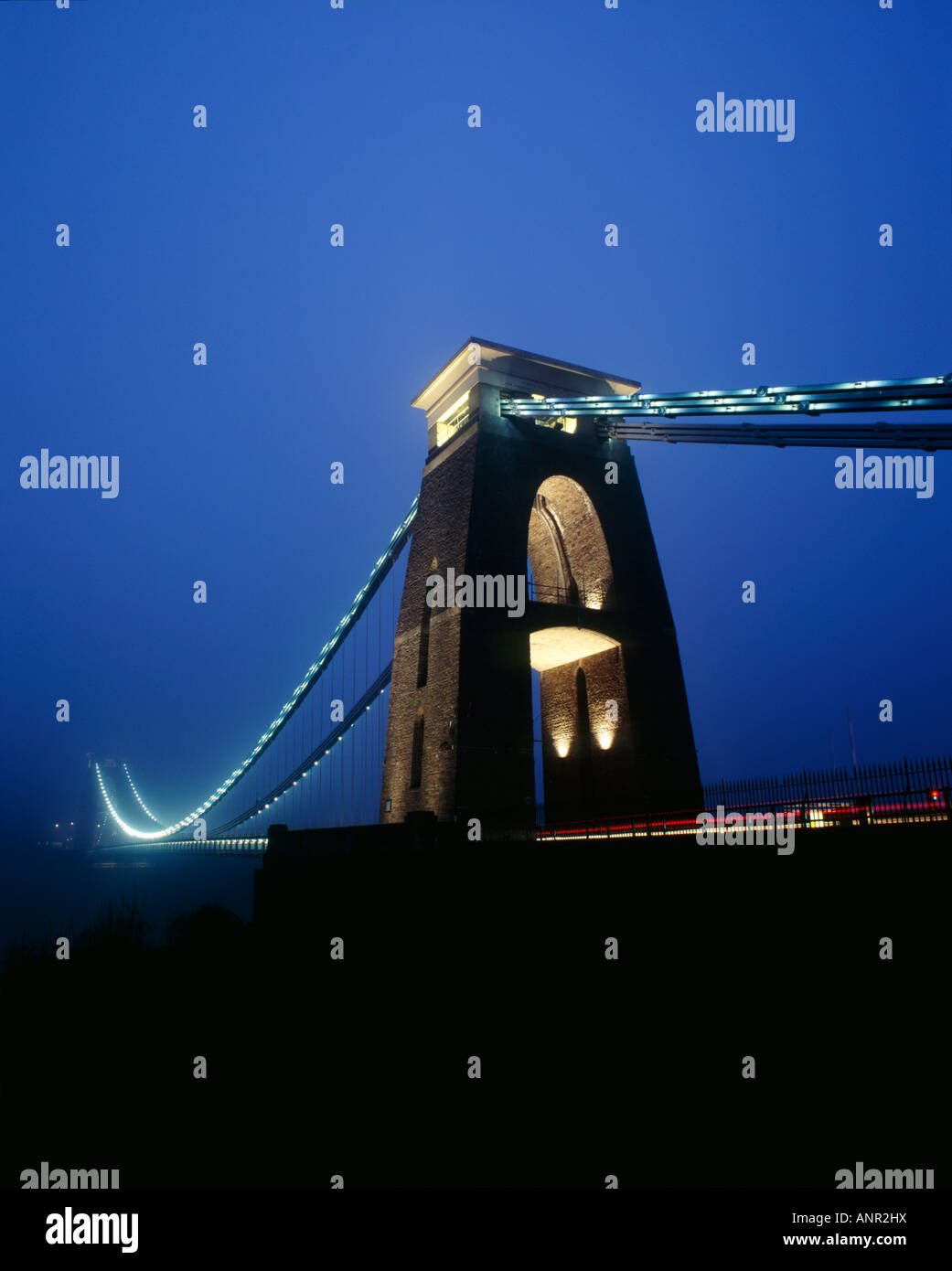 Clifton Suspension Bridge over the Avon Gorge and River Avon illuminated by LED lights at dusk. Bristol, England. Stock Photo