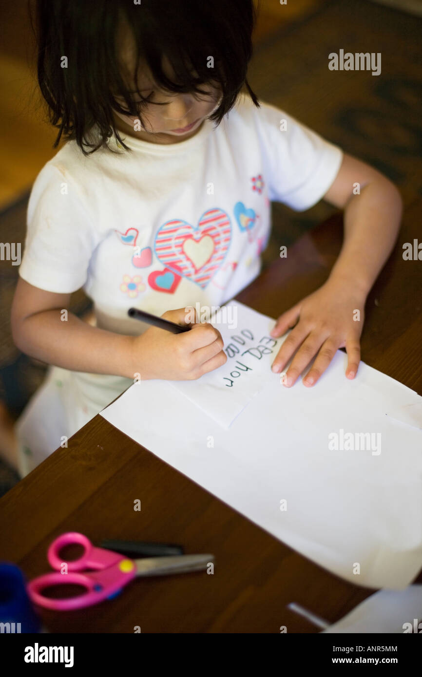 Child at play with paper Stock Photo Alamy