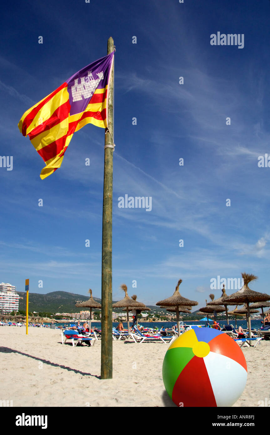 Majorcan flag beachball and people Palma Nova beach Majorca Spain Stock Photo