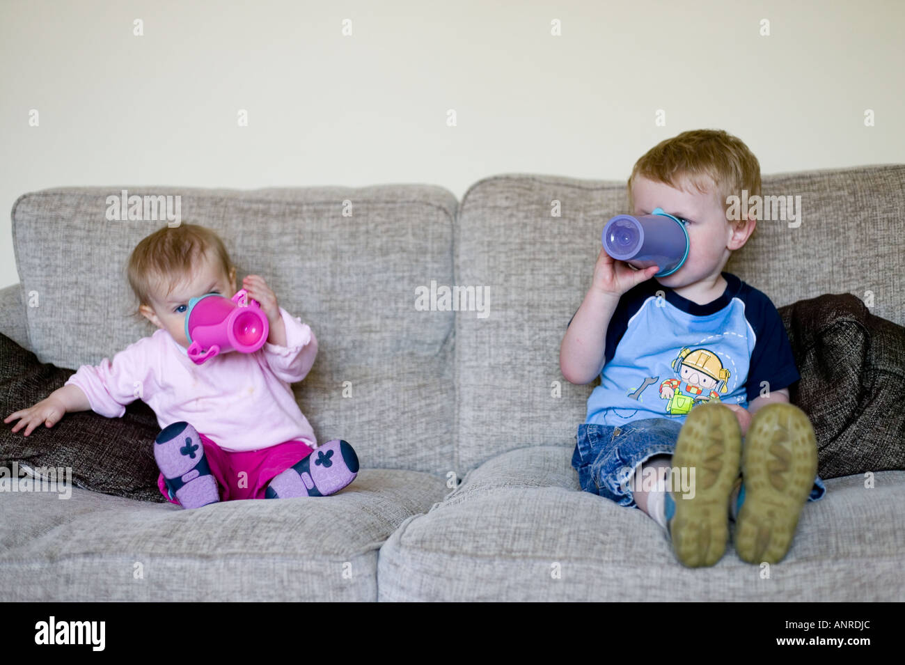 Brother and sister drinking milk Stock Photo Alamy