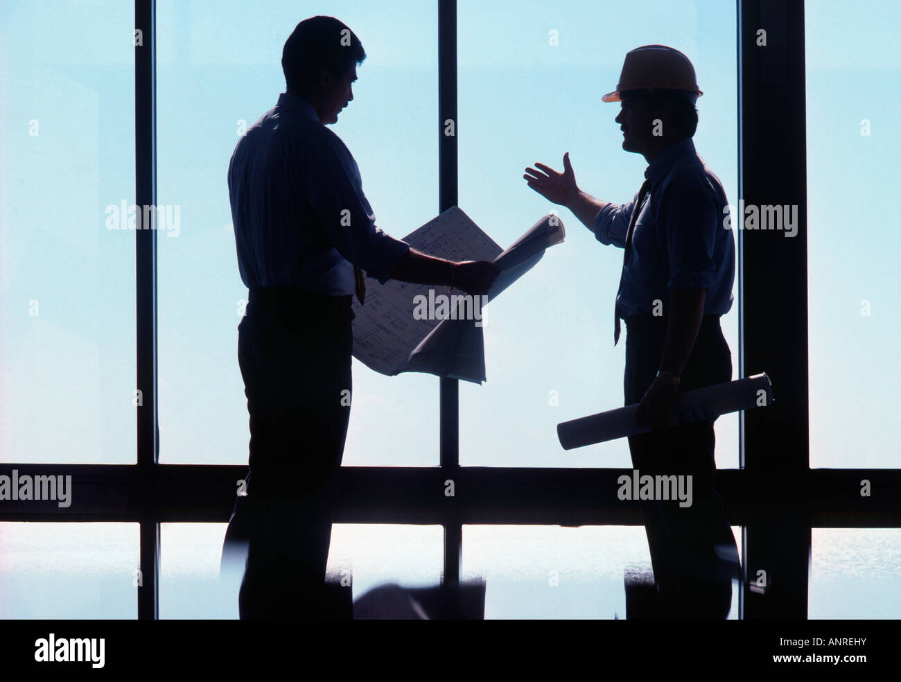 Engineer and Architect Discuss Construction Project Stock Photo