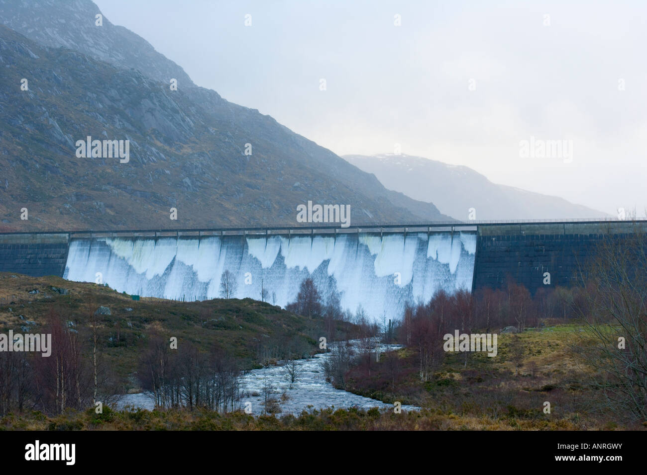 Water pouring over the dam at Loch Cluanie, Highlands, Scotland, UK
