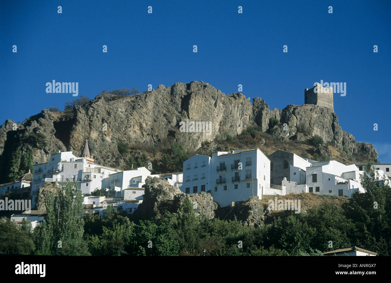 Whitewashed buildings forming the hillside village of Zahara de la ...