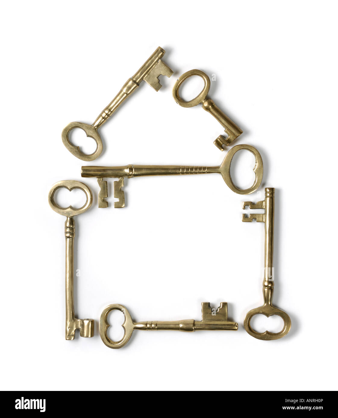 Home symbol made from shiny brass skeleton keys Stock Photo
