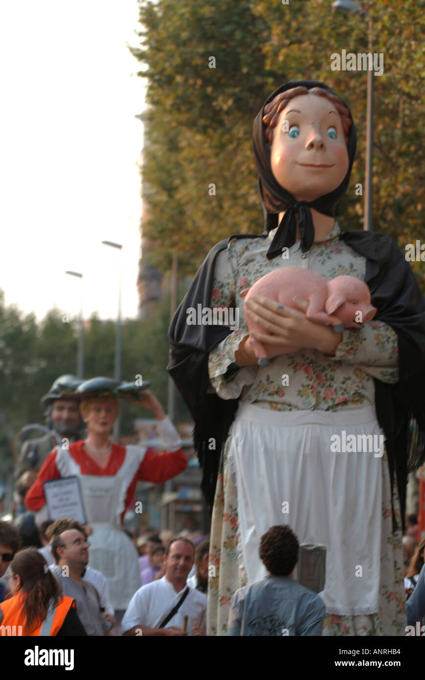 giant puppet holding a pig at la merce festival barcelona 2005 Stock