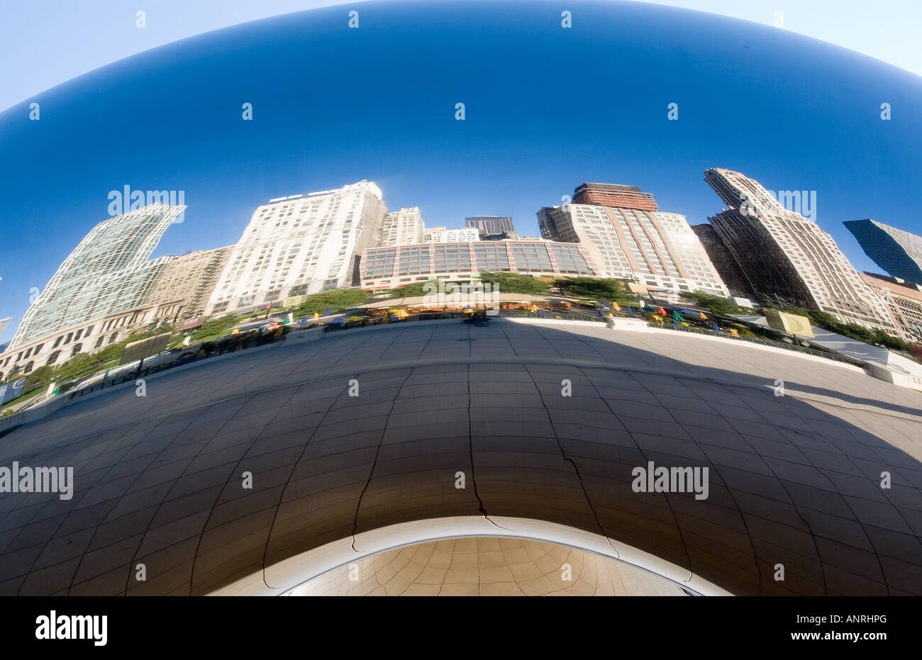 Reflection of the Chicago skyline on Cloud Gate at Millennium Park ...