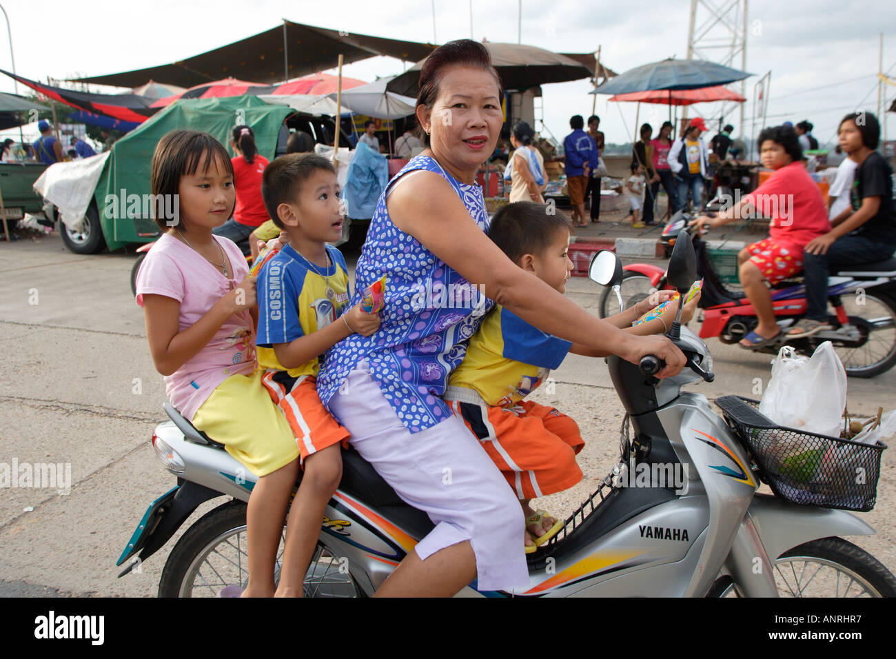 A family on a motorbike in Chiang Mai North East Thailand Stock Photo -  Alamy