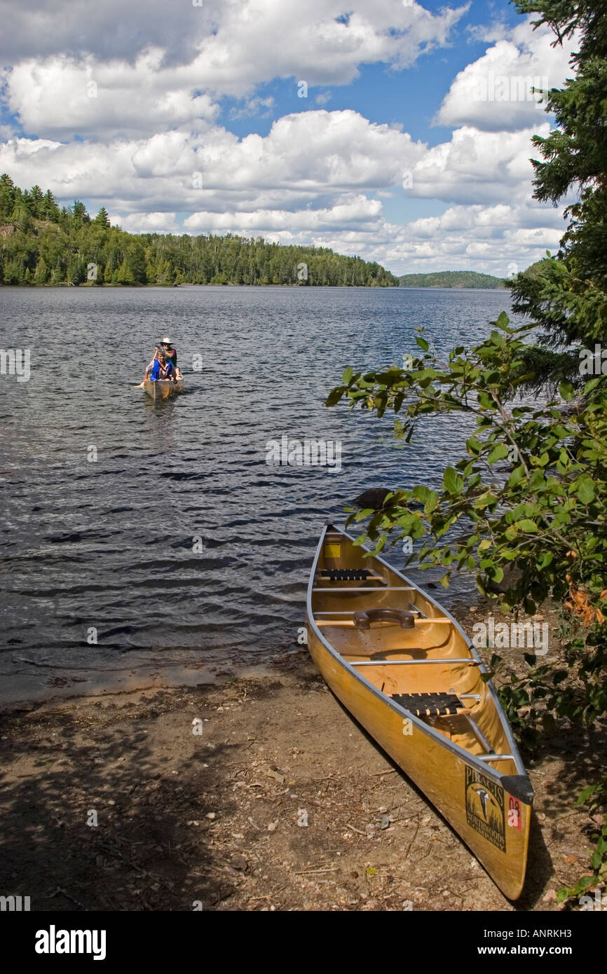 Quetico Provincial Park Ontario Canoers paddle on Agnes Lake while on a