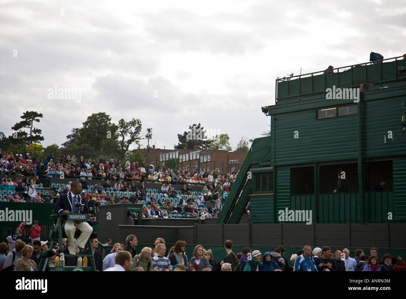 View across the tiered seating of some of the outside courts during the 2007 Wimbledon Lawn Tennis Championships, London. Stock Photo