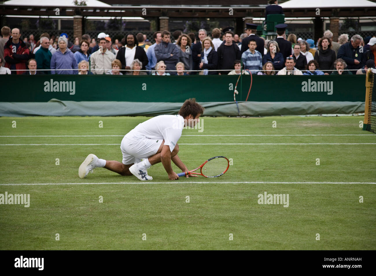 Fabrice Santoro awaits his partner's Nenad Zimonjic serve during their