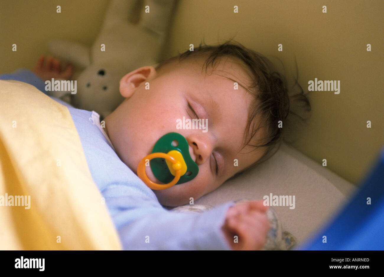Baby sleeping with a comforter Stock Photo Alamy