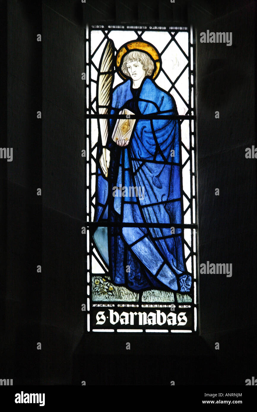 Stained glass window by William Morris & Co. circa 1870s depicting Saint Barnabas in window of Ponsonby Church, Calder Bridge, Cumbria Stock Photo