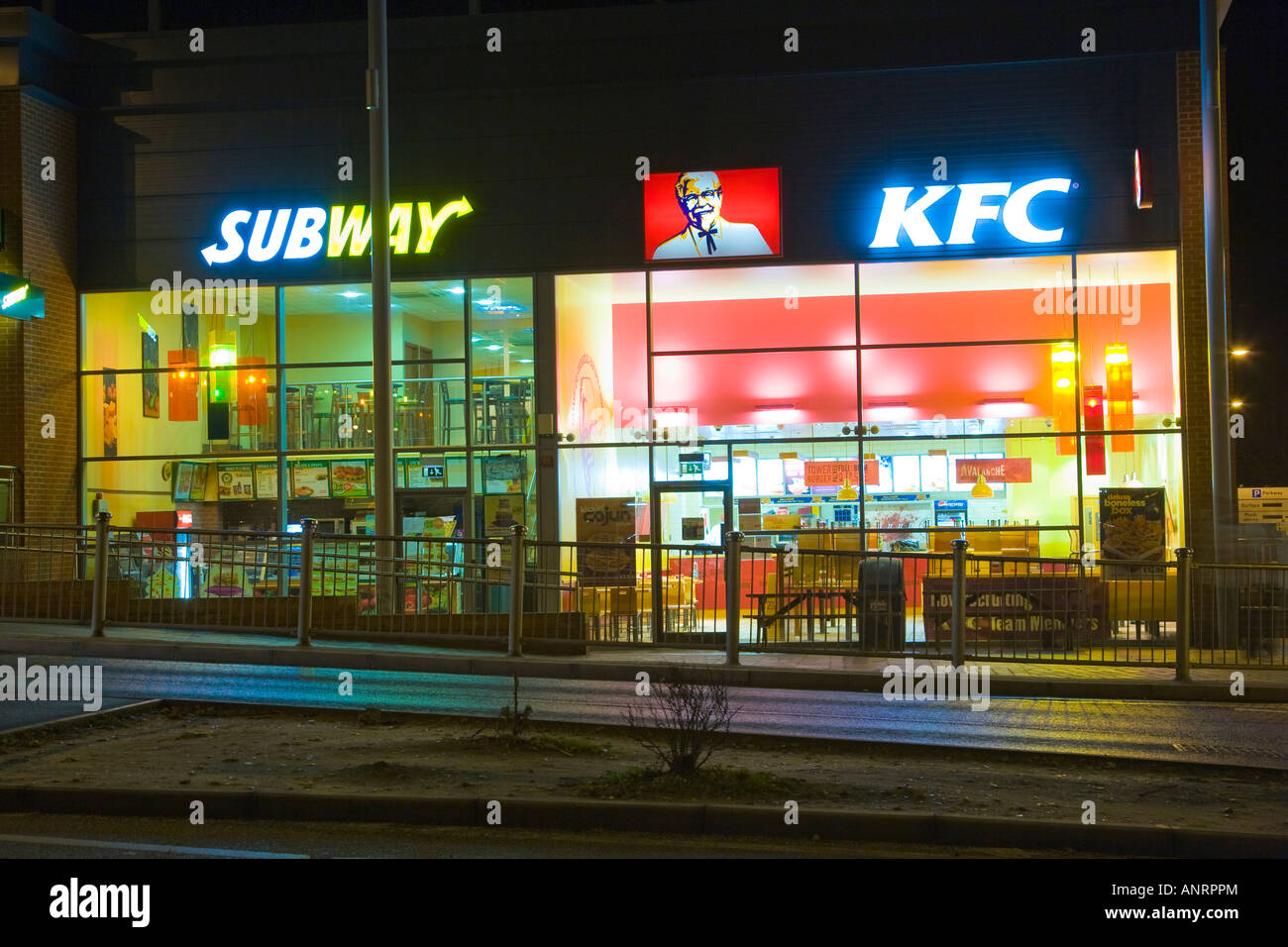 KFC and Subway food restaurants at night in Bury St Edmunds, UK Stock Photo