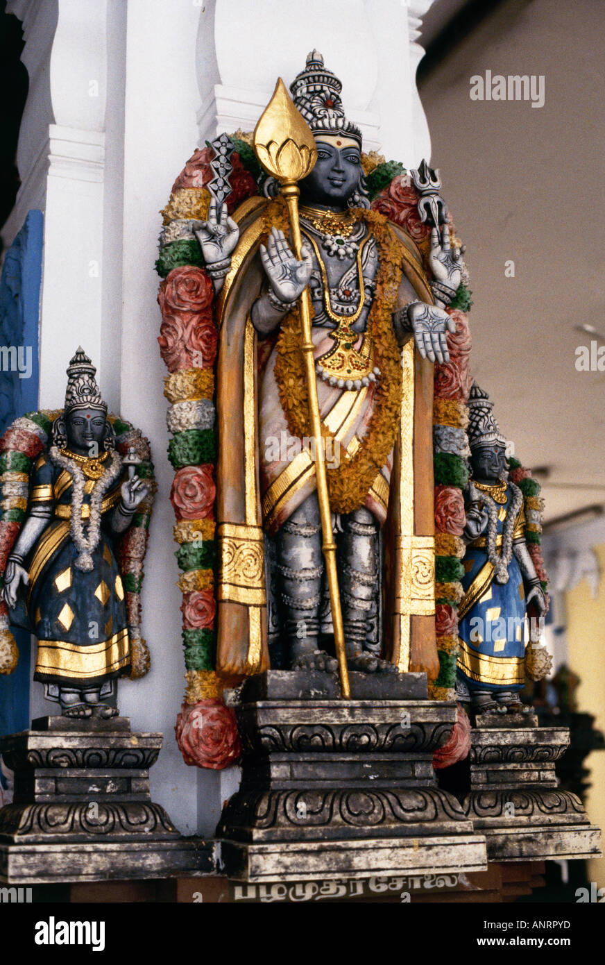 Elaborate statues of Hindu gods are housed within a courtyard of