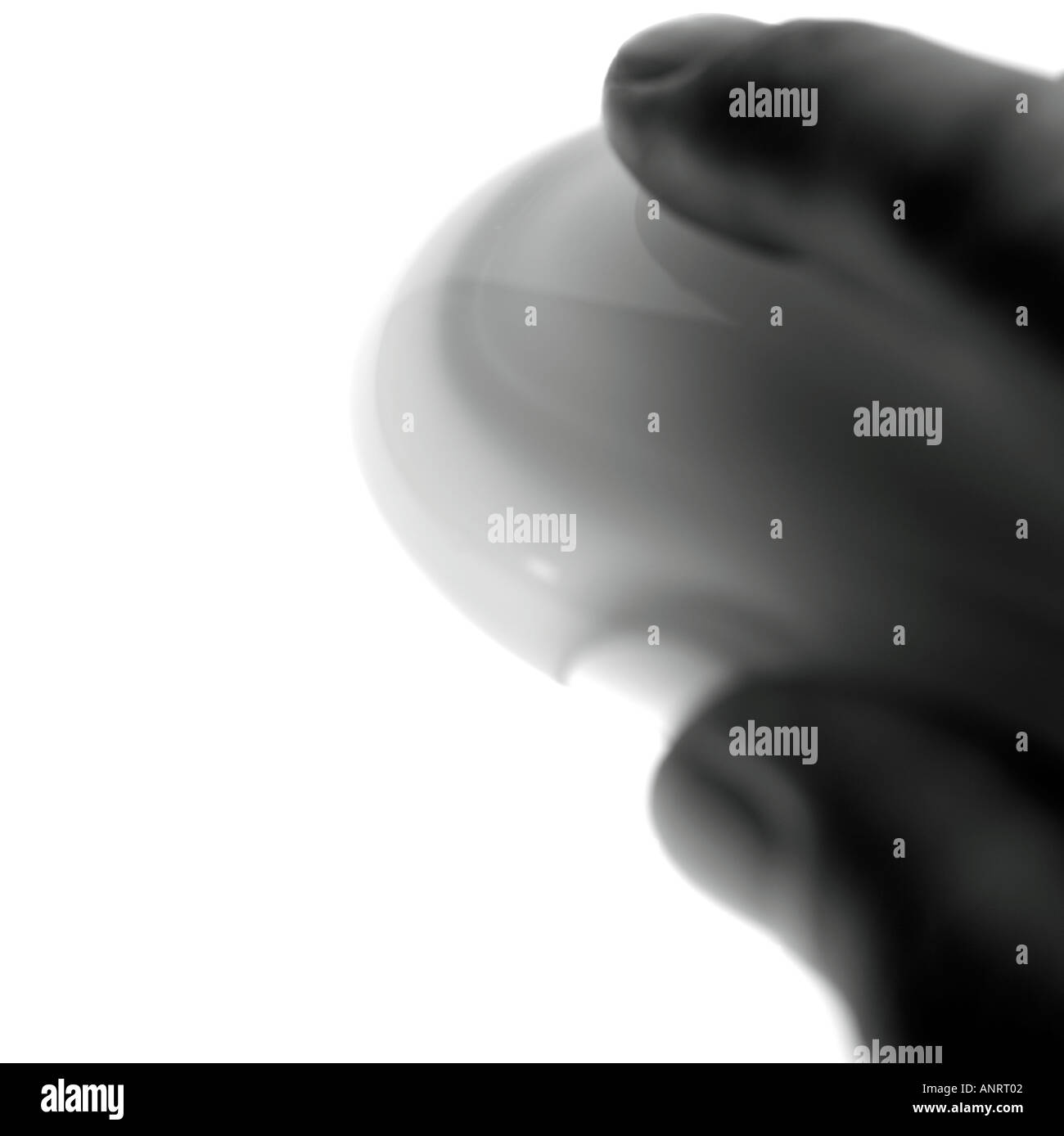 BLURRED MONO IMAGE OF A HAND USING A WIRELESS MOUSE Stock Photo