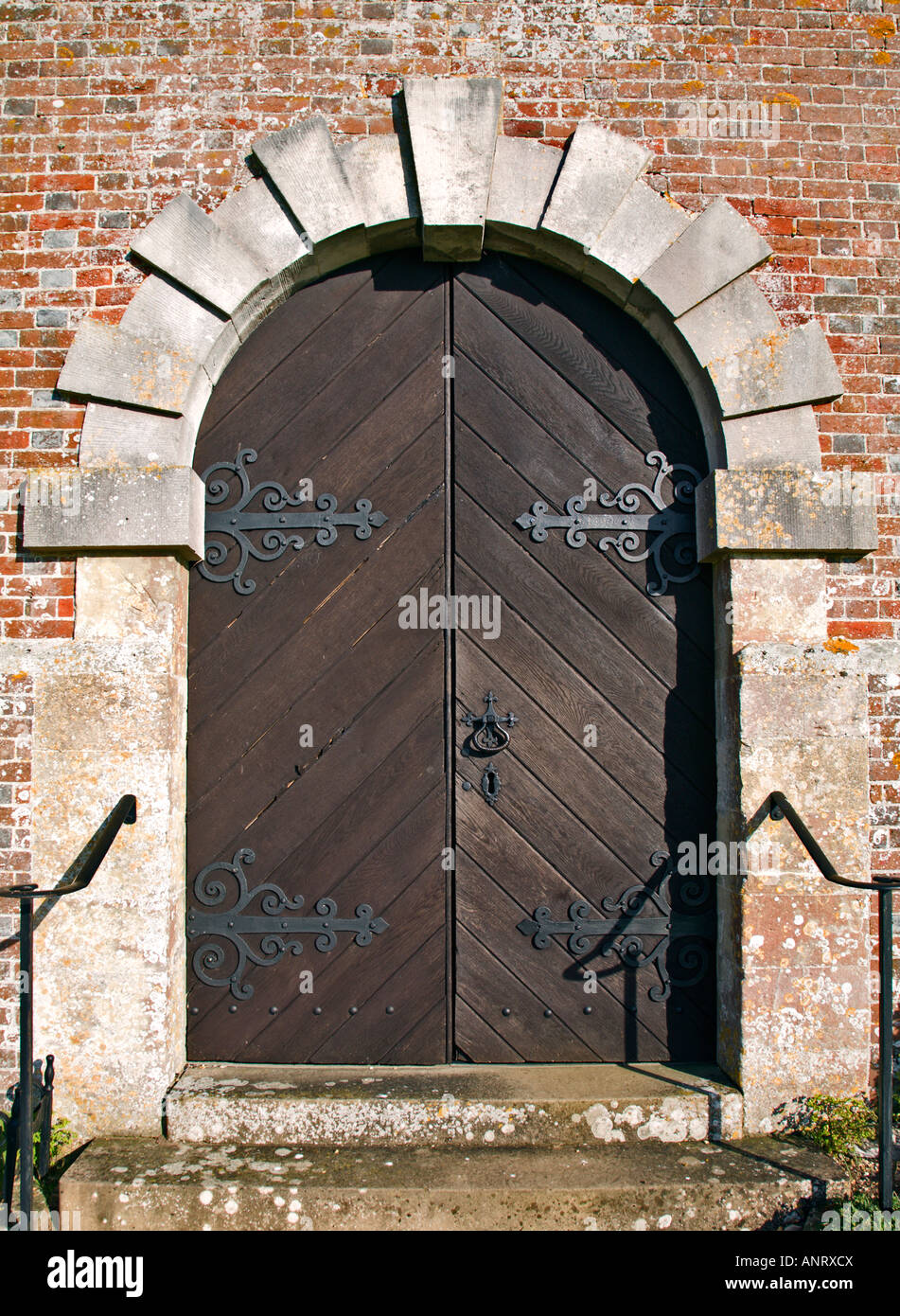 Wooden Arched Church Door Stock Photo