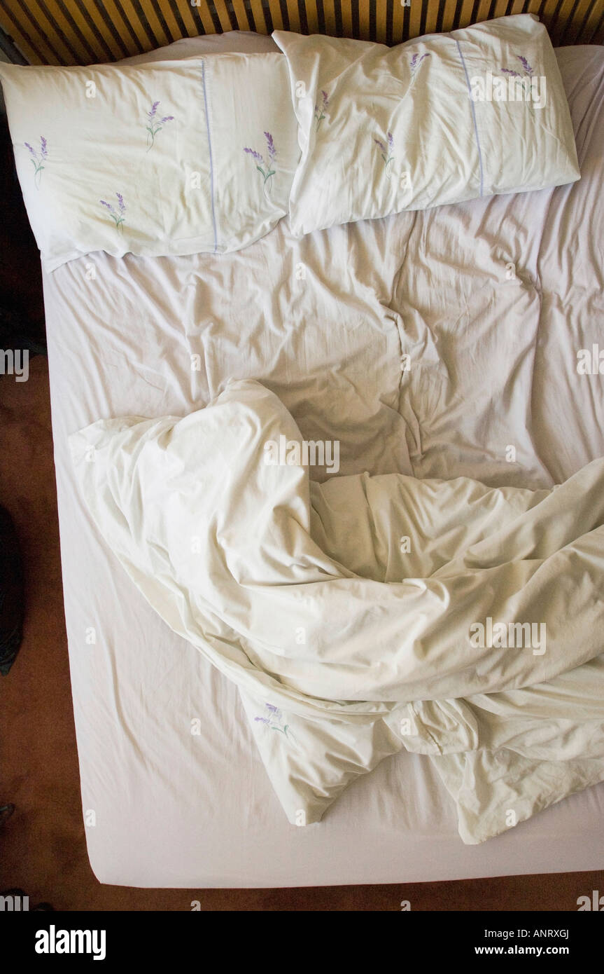 Unmade double bed, elevated view Stock Photo
