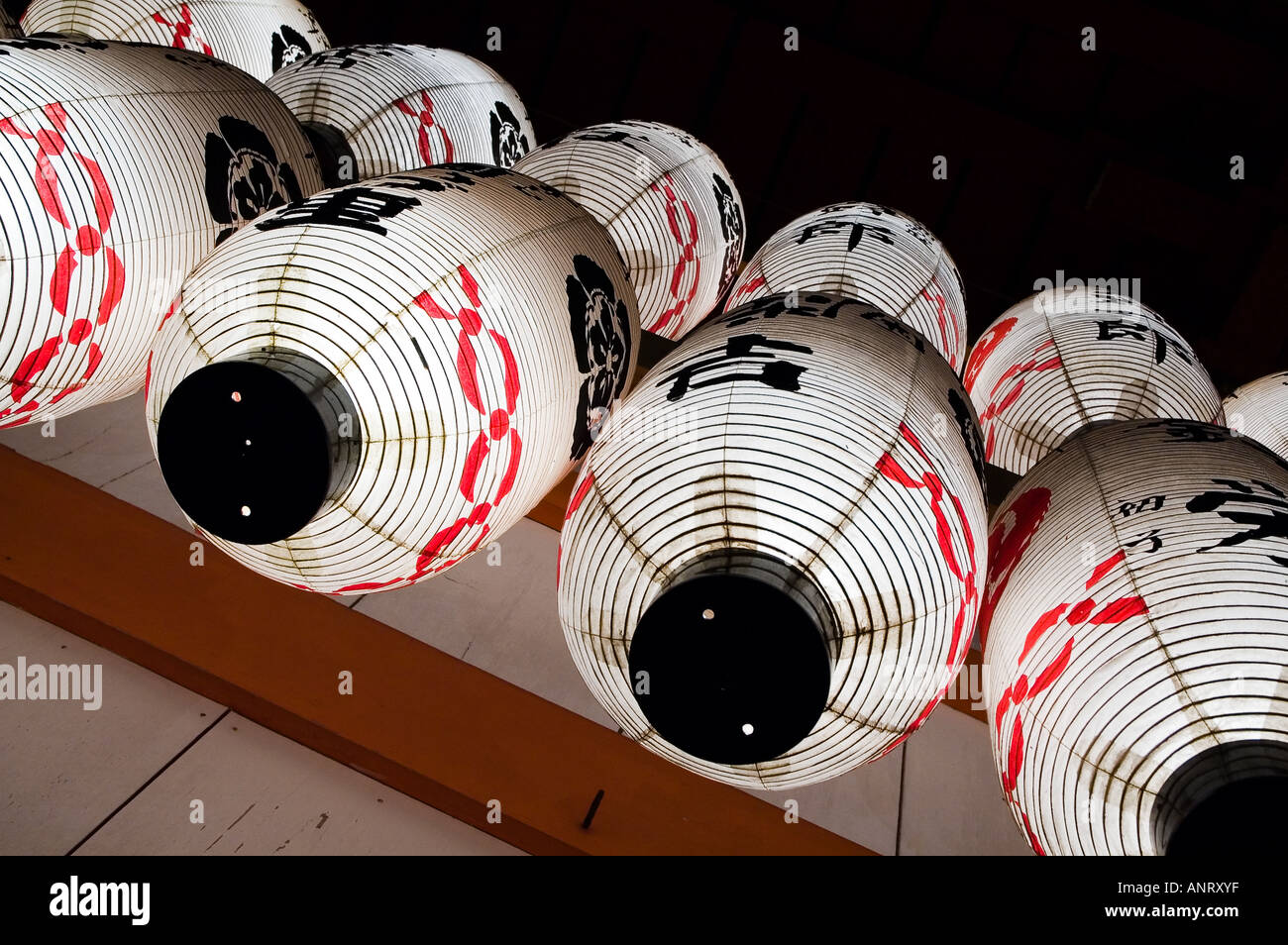 Traditional white Japanese paper lanterns hang at the Yasaka Shrine in