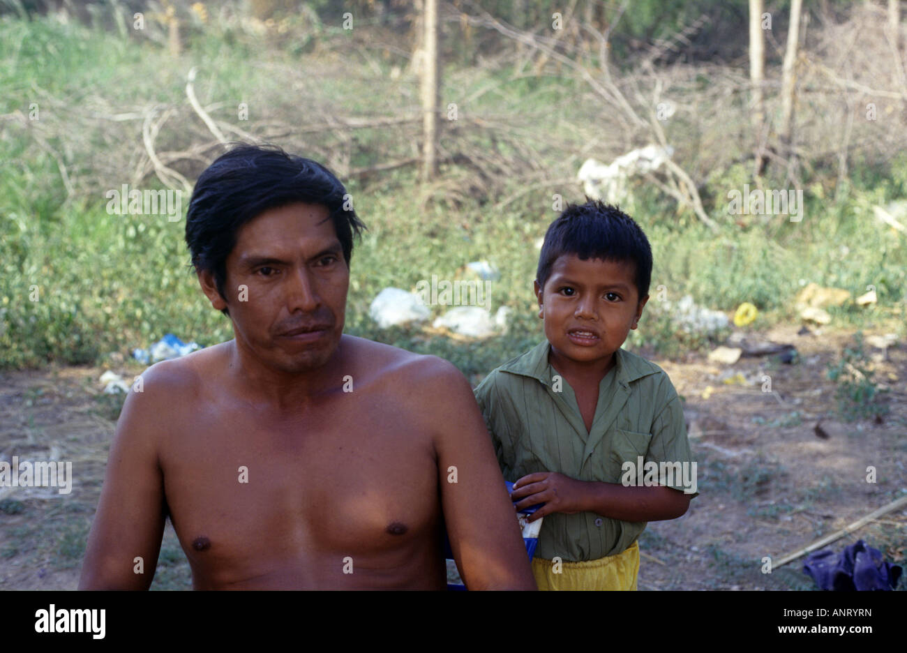 A pilaga indian man and his son Stock Photo