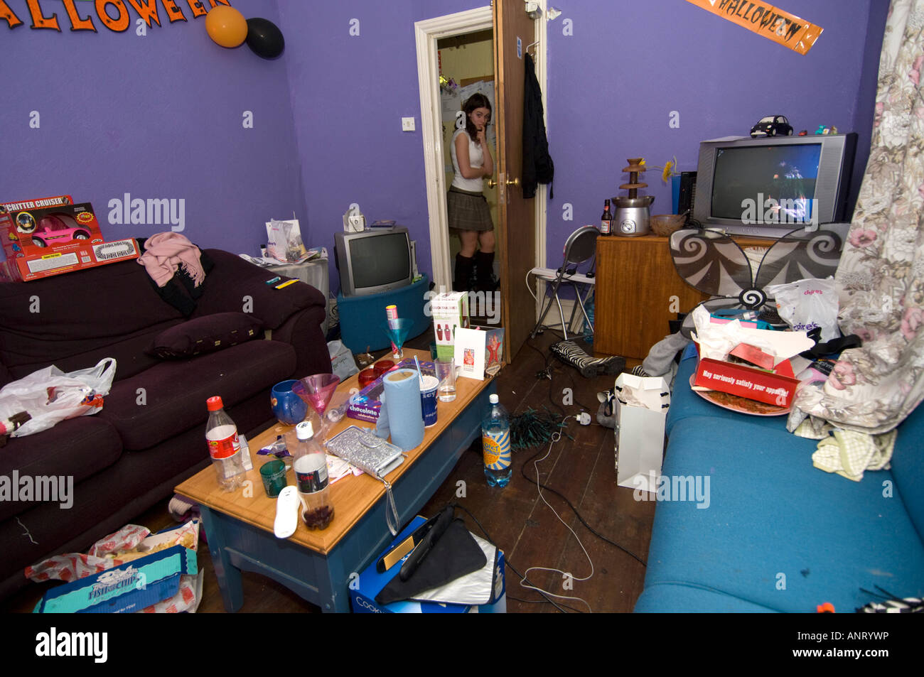 An untidy room in a student house the morning after a party Stock Photo