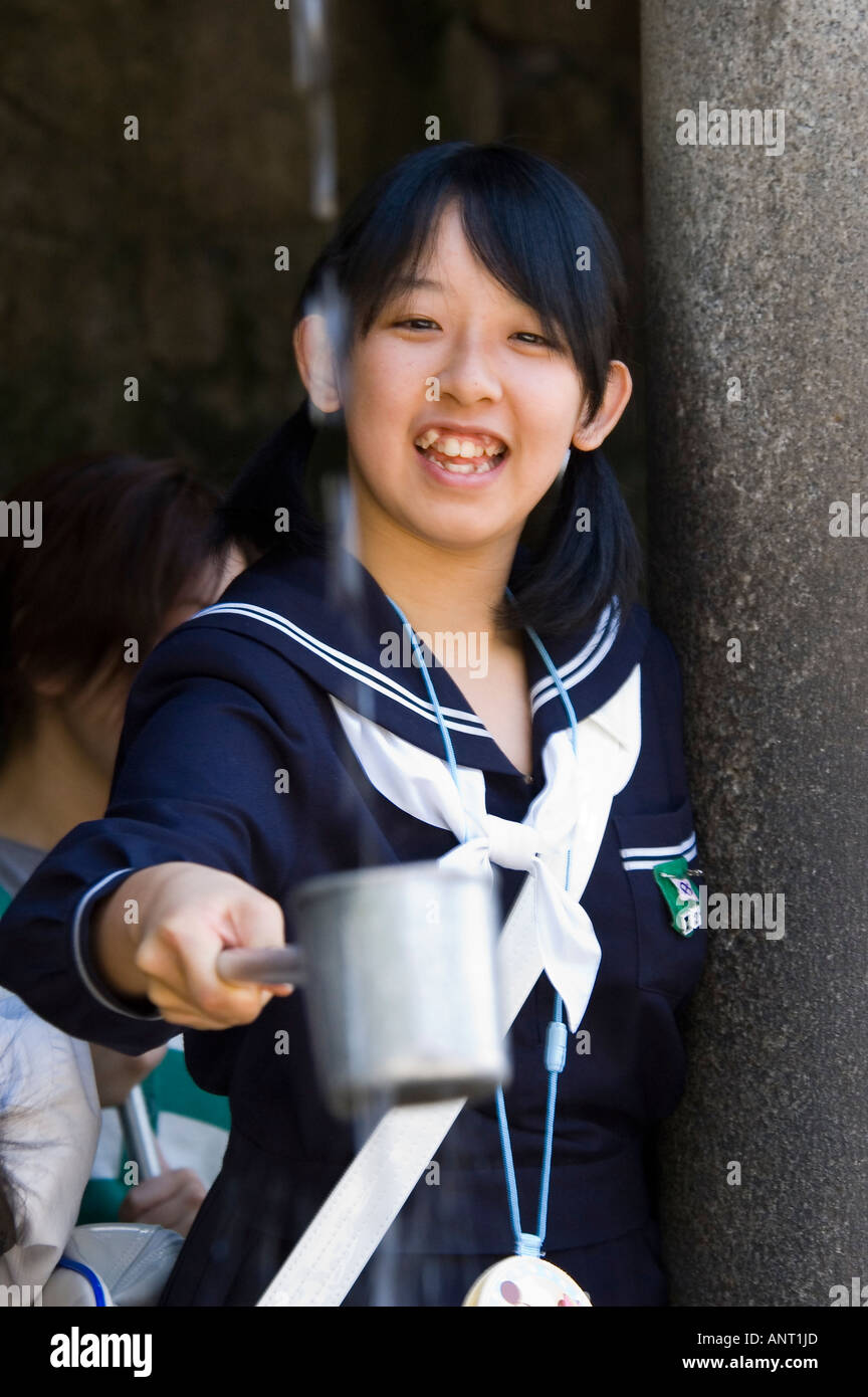 Stock Photo Of A Japanese Schoolgirl Getting A Drink Of Kiyomizudera Stock Photo Alamy