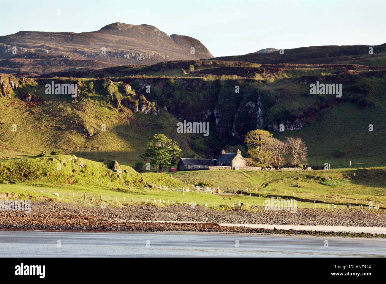 House at Laig Bay, with An Sgurr in the background, Isle of Eigg,  Scotland Stock Photo