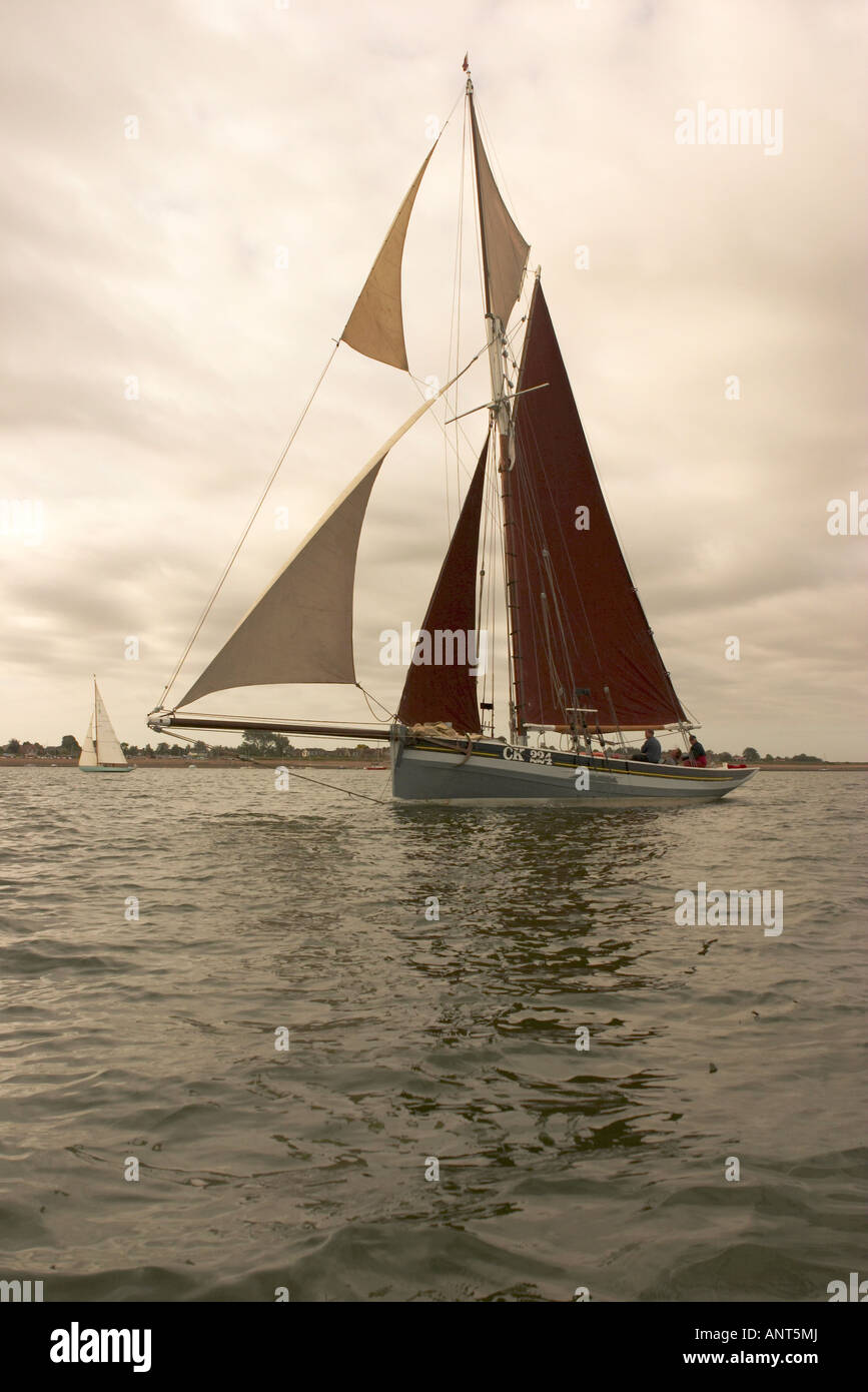 Traditional gaff rigged sailing boat or Smack in full sail. Stock Photo