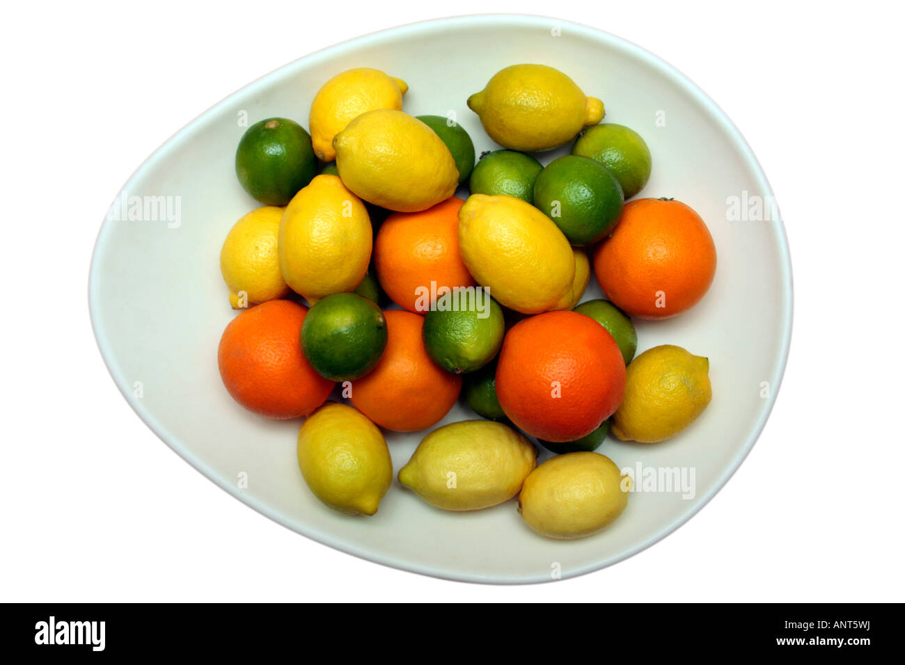 lemons limes and oranges in an oval bowl cutout Stock Photo - Alamy