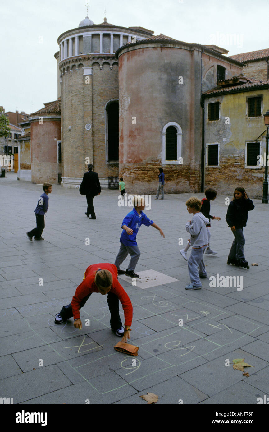 Venice Italy Children playing games in Campo San Giacomo dell'Orio in the  quarter of Santa Croce Stock Photo - Alamy