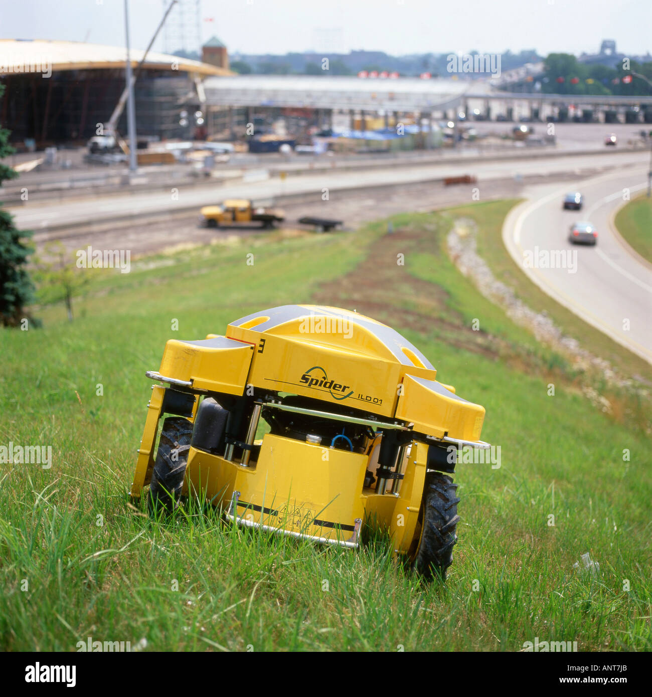 A remote control industrial grass cutter near the Peace Bridge Fort Erie Ontario Canada Stock Photo