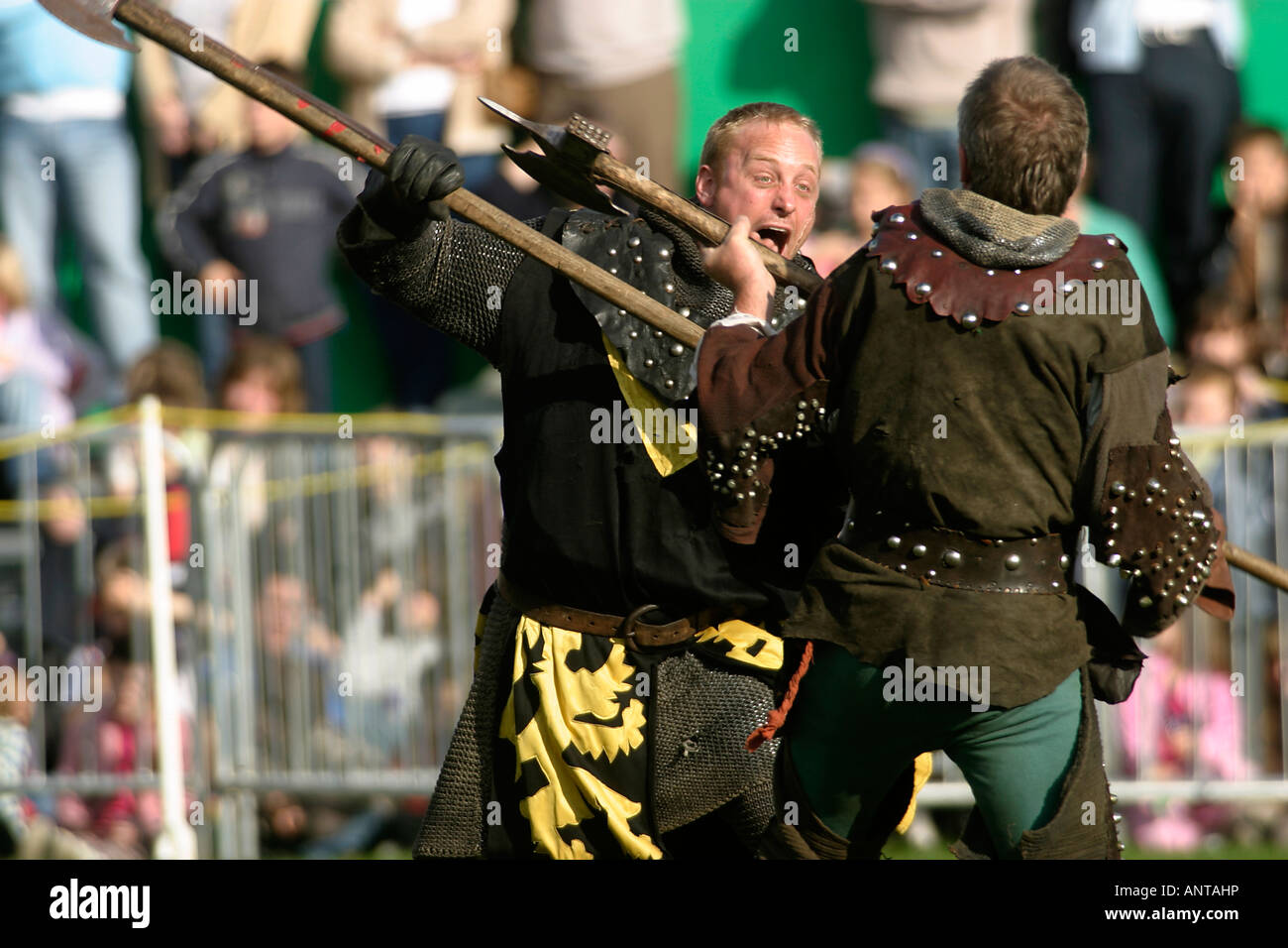 Knights of Nottingham, Medieval re-enactors, dueling in the annual Robin Hood Pageant, Nottingham Castle, Nottingham, UK. This represents a duel with halberds Stock Photo