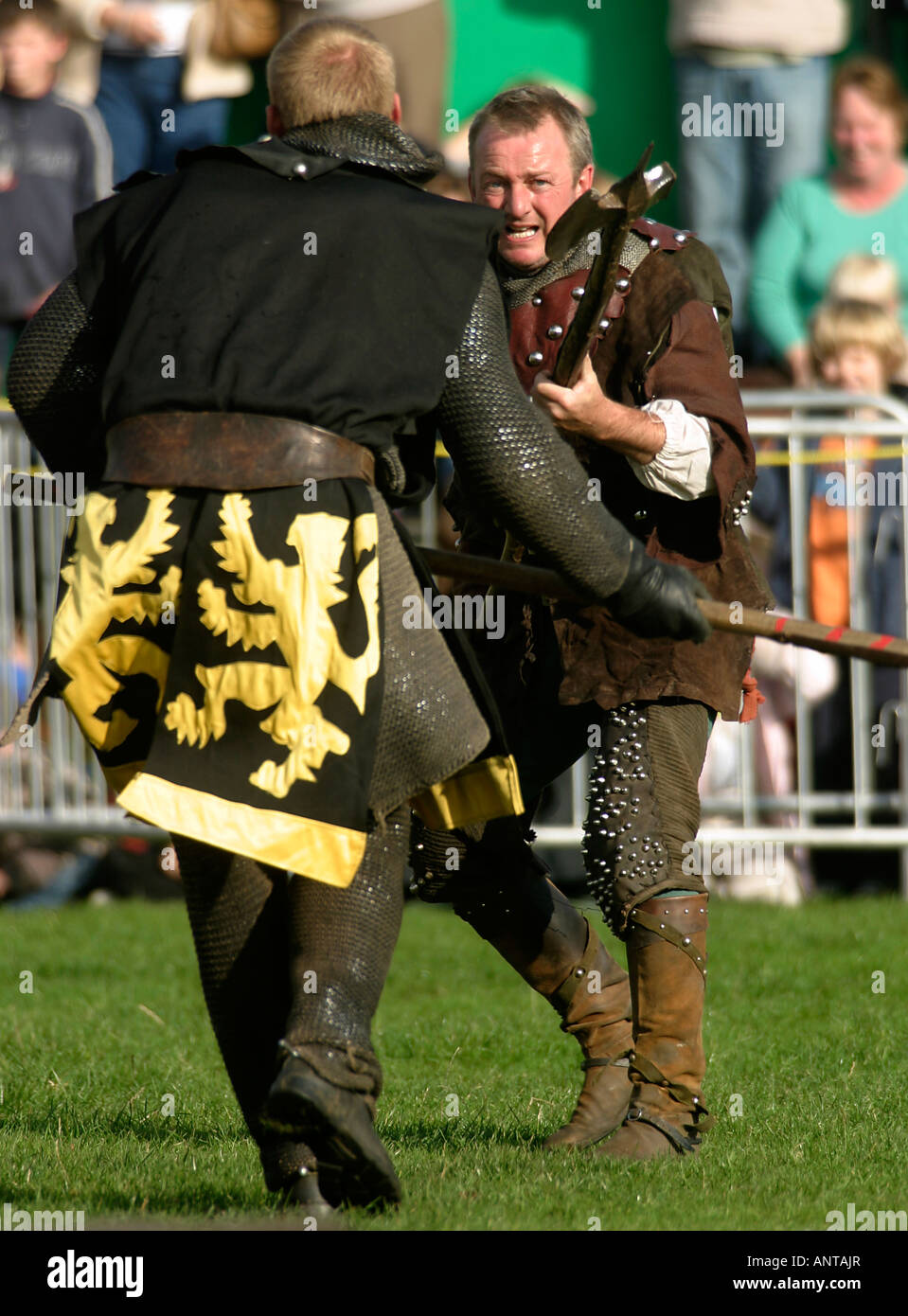 Knights of Nottingham, Medieval re-enactors, dueling in the annual Robin Hood Pageant, Nottingham Castle, Nottingham, UK. This represents a duel with halberds Stock Photo