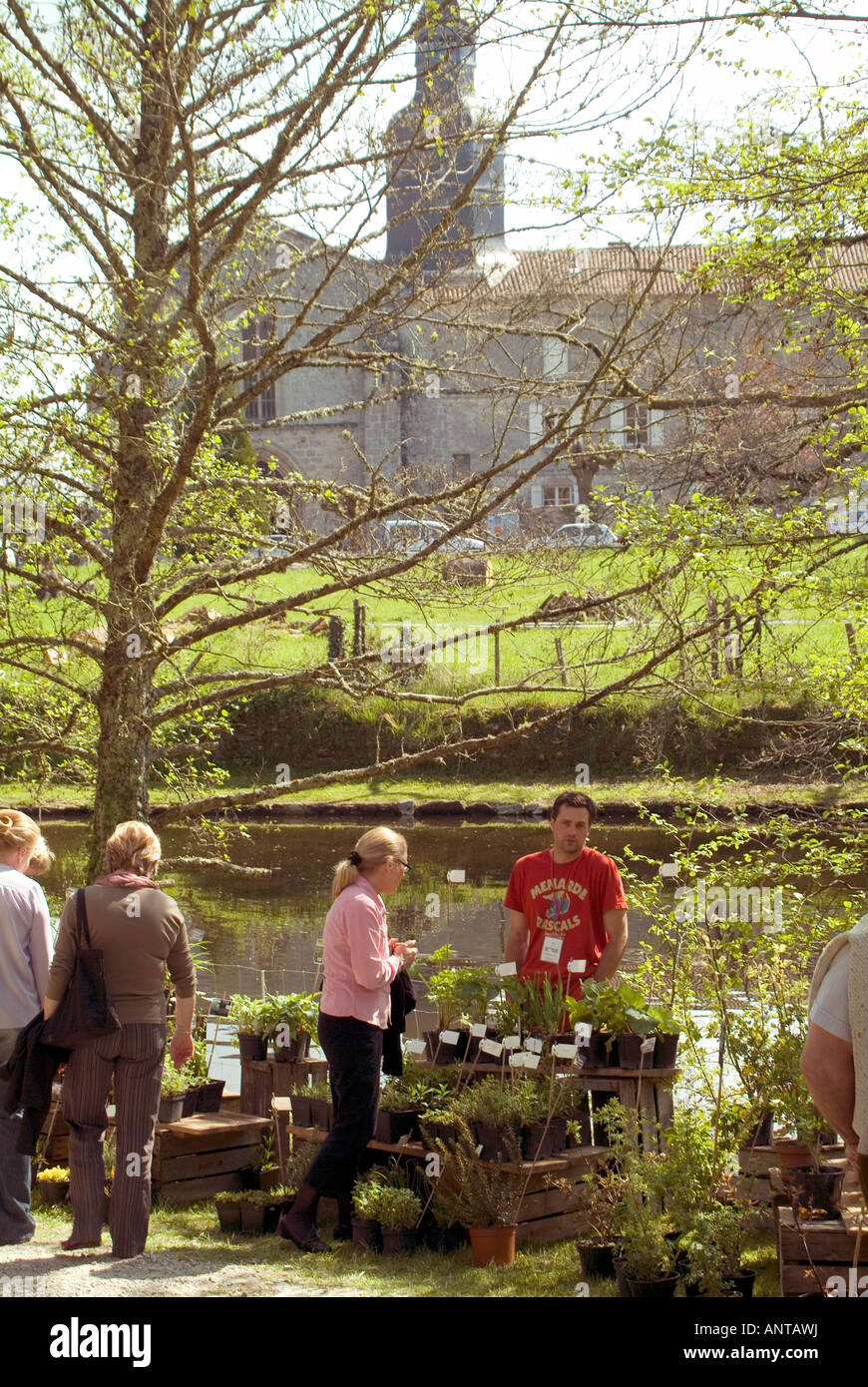 people enjoying looking buying plants at a garden show in a the grounds of a chateau in central france Stock Photo