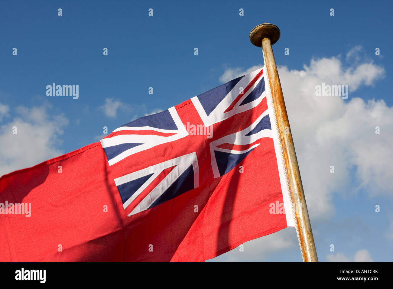 British maritime red ensign flag against blue sky Stock Photo Alamy