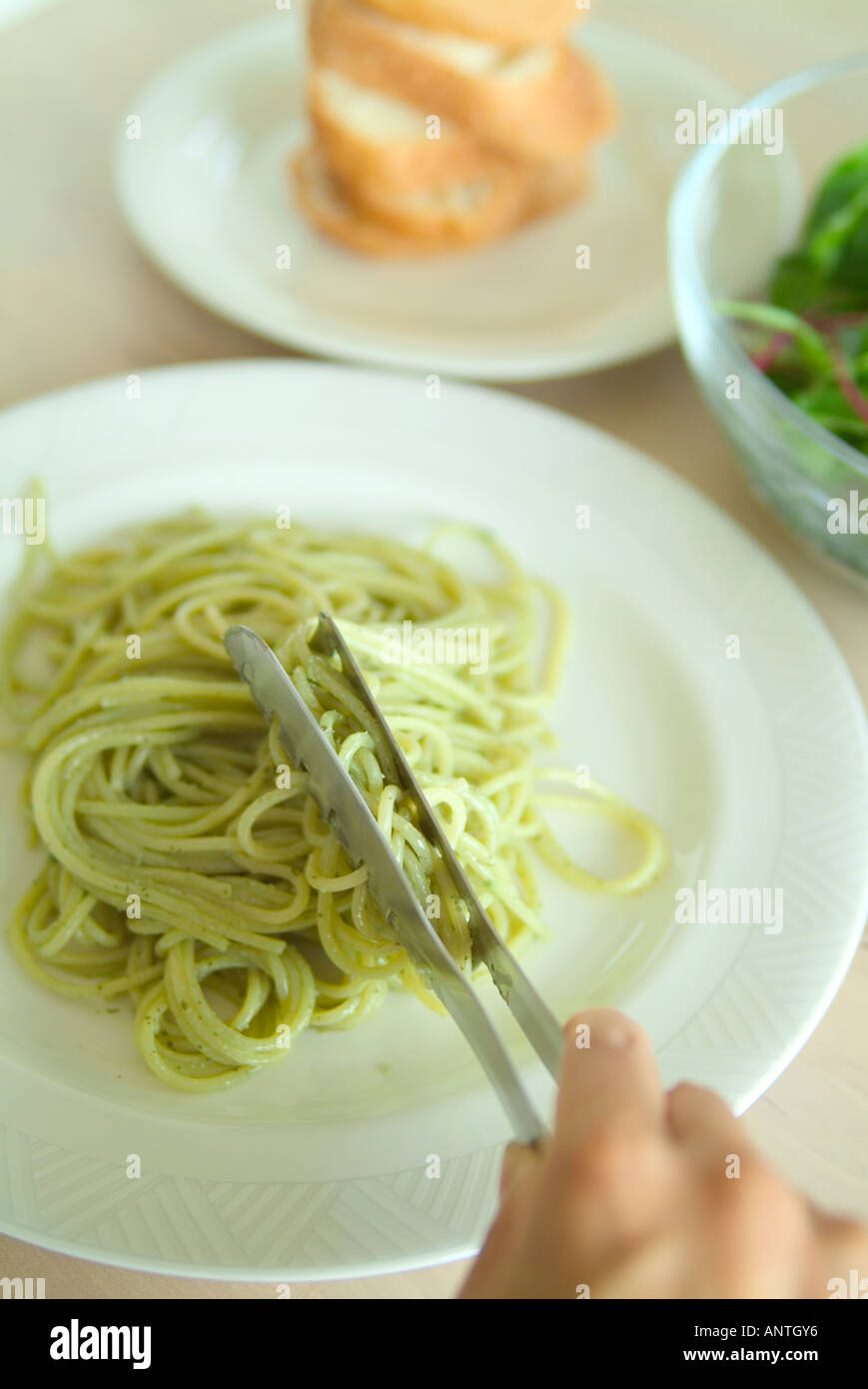 Serving spaghetti on plate Stock Photo Alamy