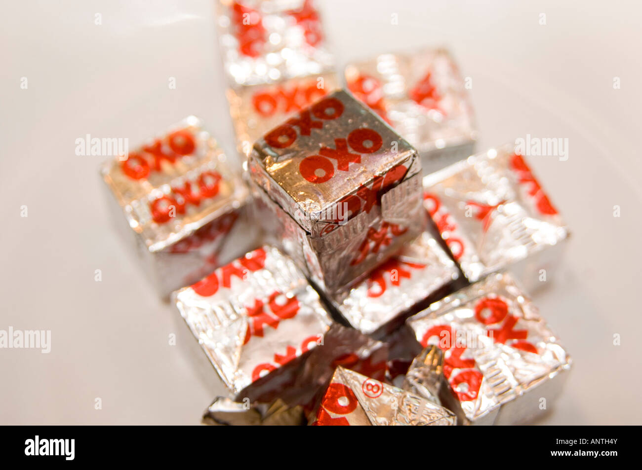 https://c8.alamy.com/comp/ANTH4Y/pile-of-silver-paper-wrapped-oxo-beef-stock-cubes-on-plate-ANTH4Y.jpg