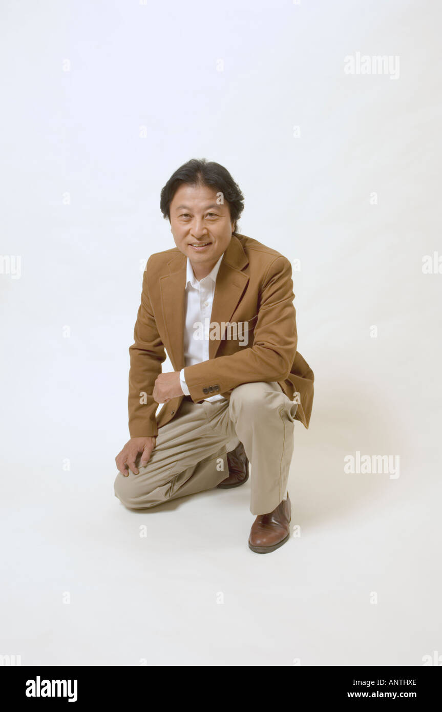 Black man kneeling hi-res stock photography and images - Alamy