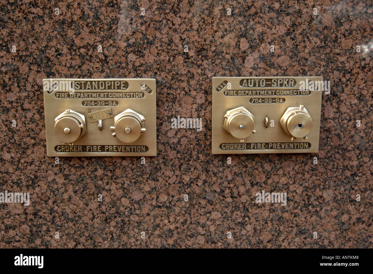 Brass Standpipe set in a marble wall Stock Photo Alamy
