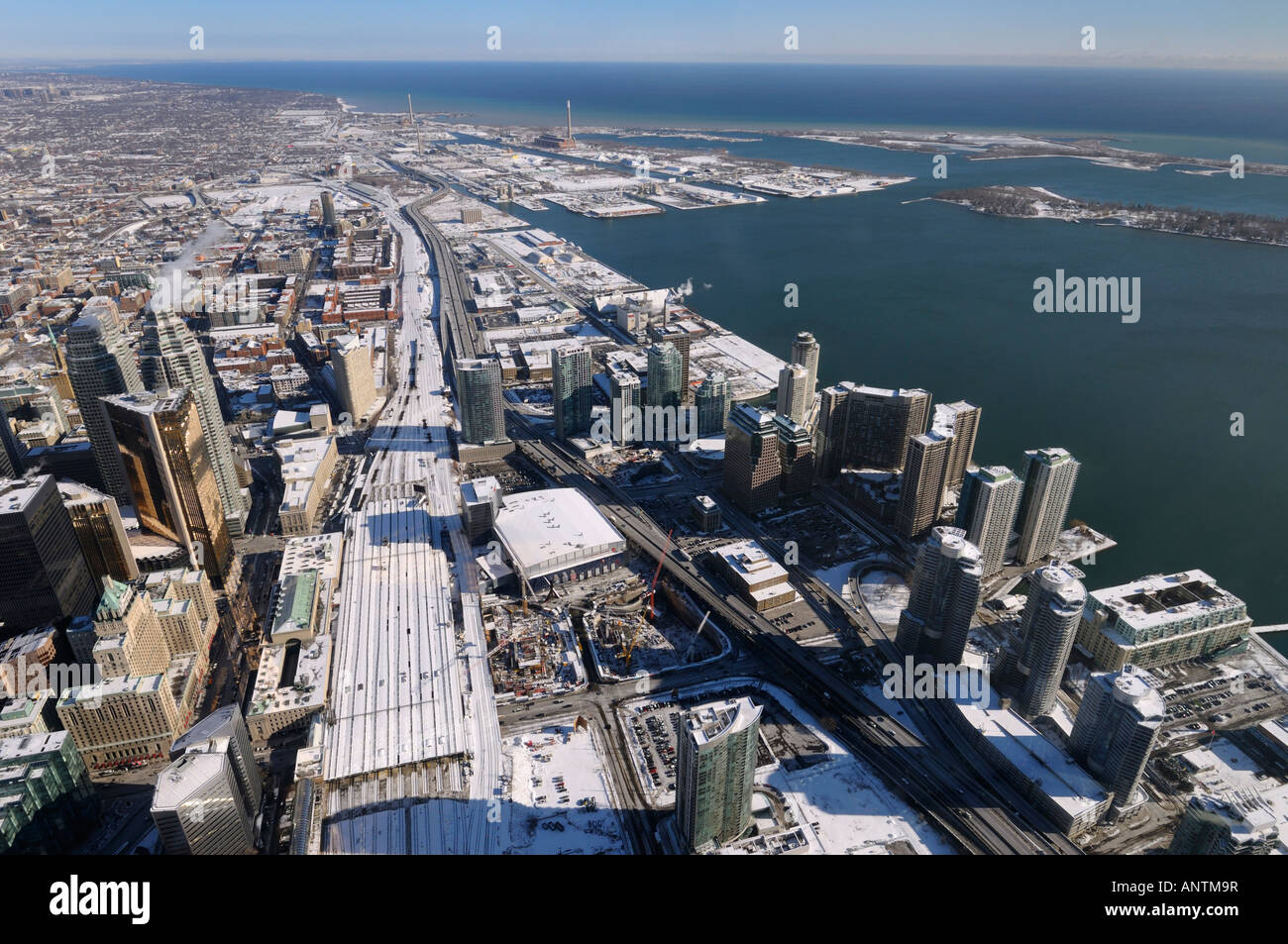 Aerial view of Toronto Union Station and Harbourfront east in winter including Toronto Islands and lake Ontario from the CN Tower Stock Photo