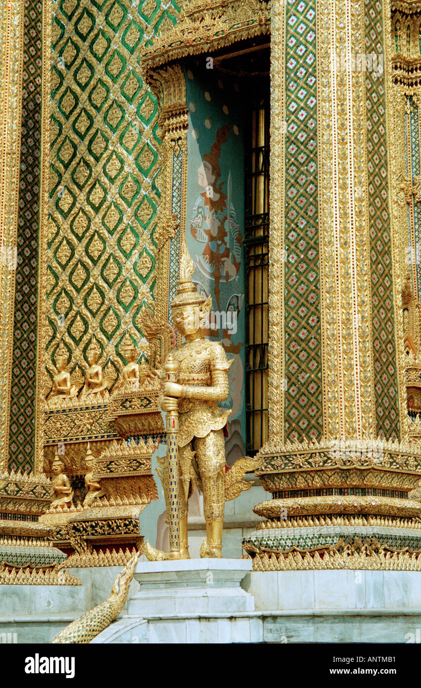 Golden garudas guard the entrance to the royal pantheon holding statues of former kings of Thailand Grand Palace Bangkok Stock Photo