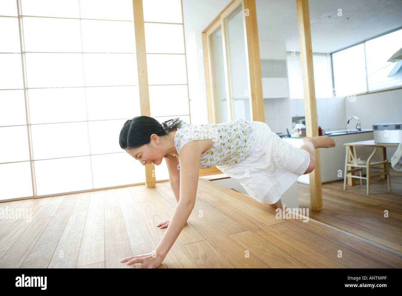 Young woman tripping over step Stock Photo