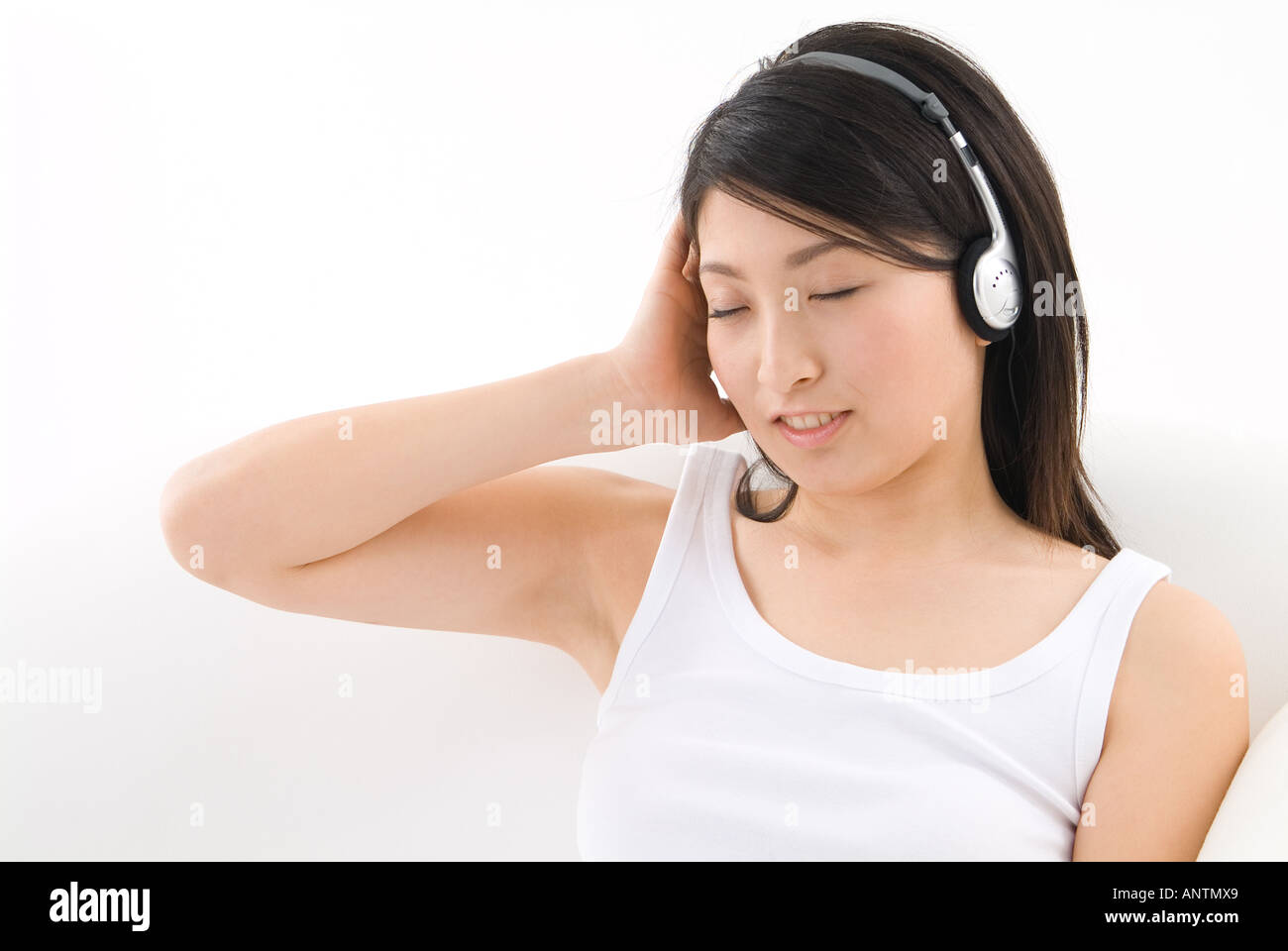 Young woman wearing headphones Stock Photo
