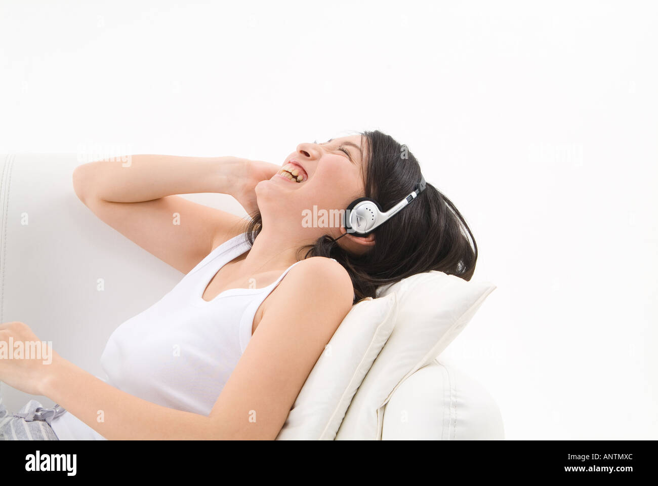 Young woman wearing headphones Stock Photo