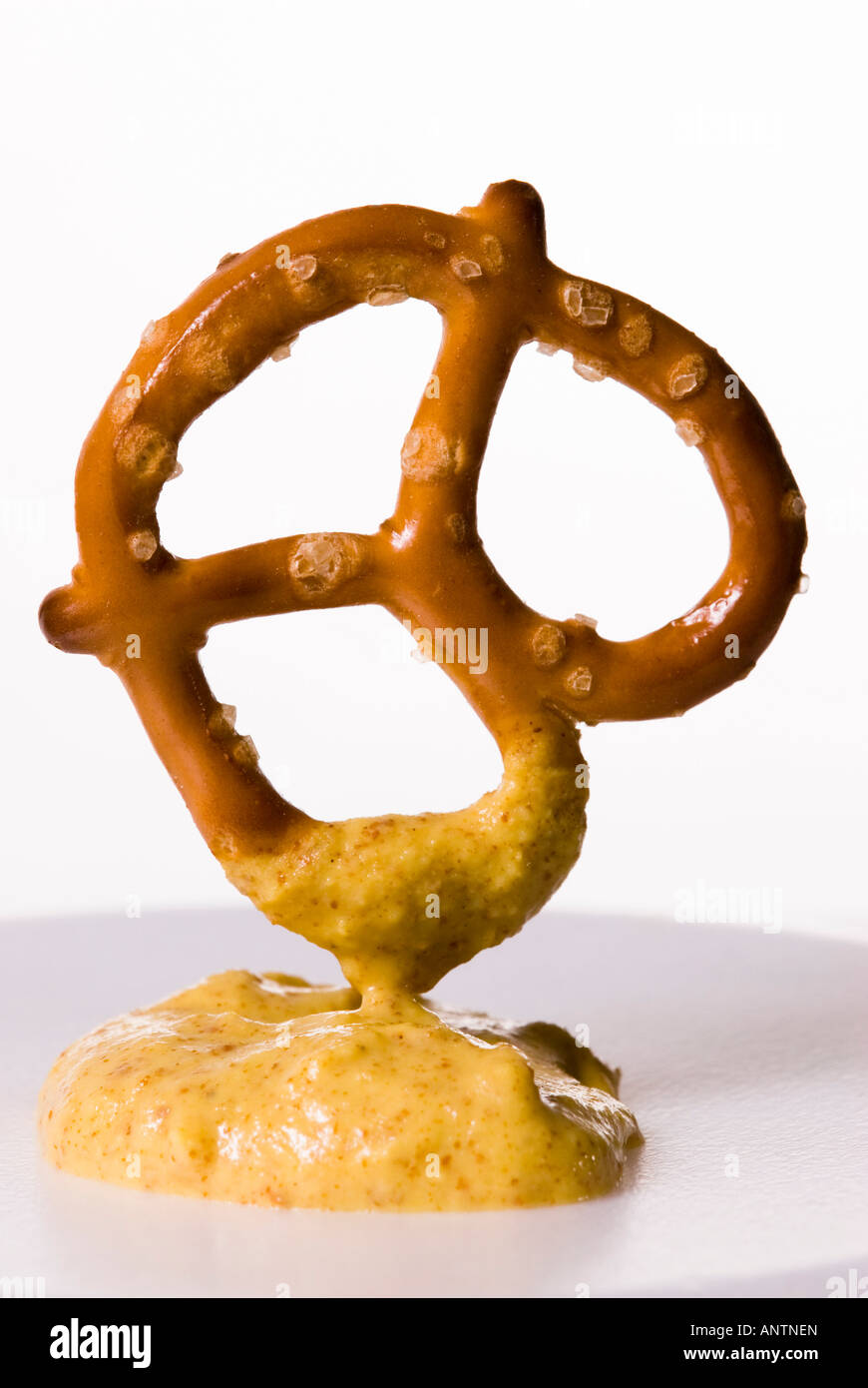 a baked twisted pretzel with a horseradish mustard dip Stock Photo Alamy